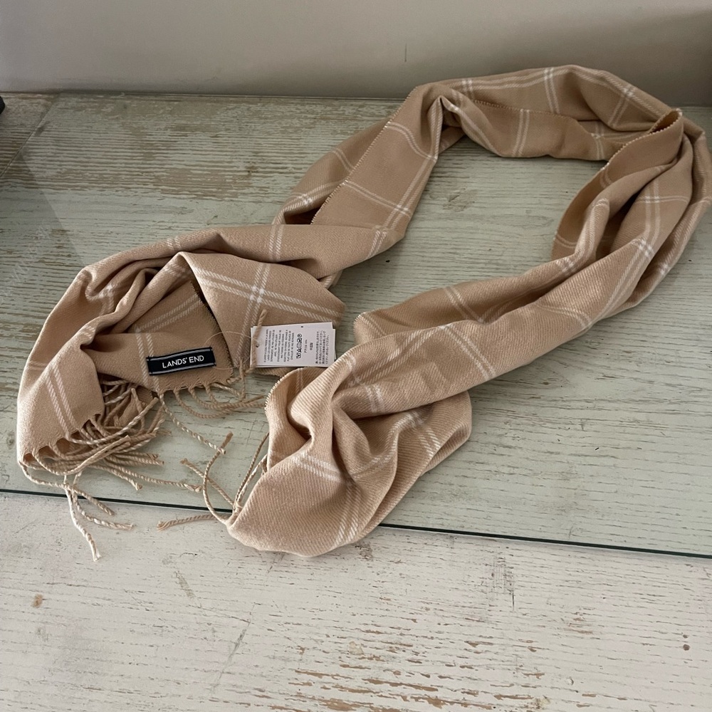 This is a cashmere scarf never used. It is made by lands end.